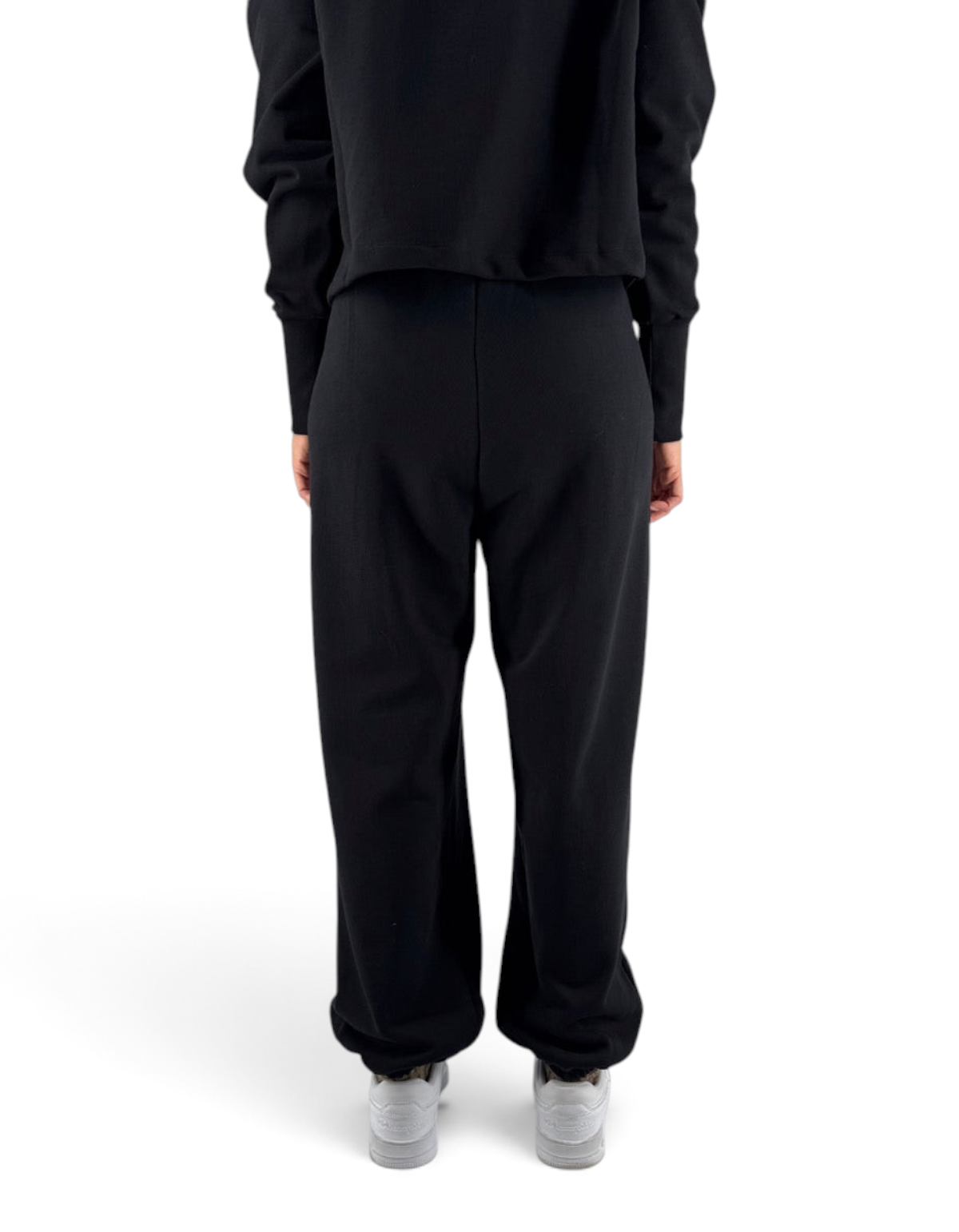 Pantalone donna oversize in felpa nero Marcelo Burlon - County Of Milan visto da dietro su DevidLabel