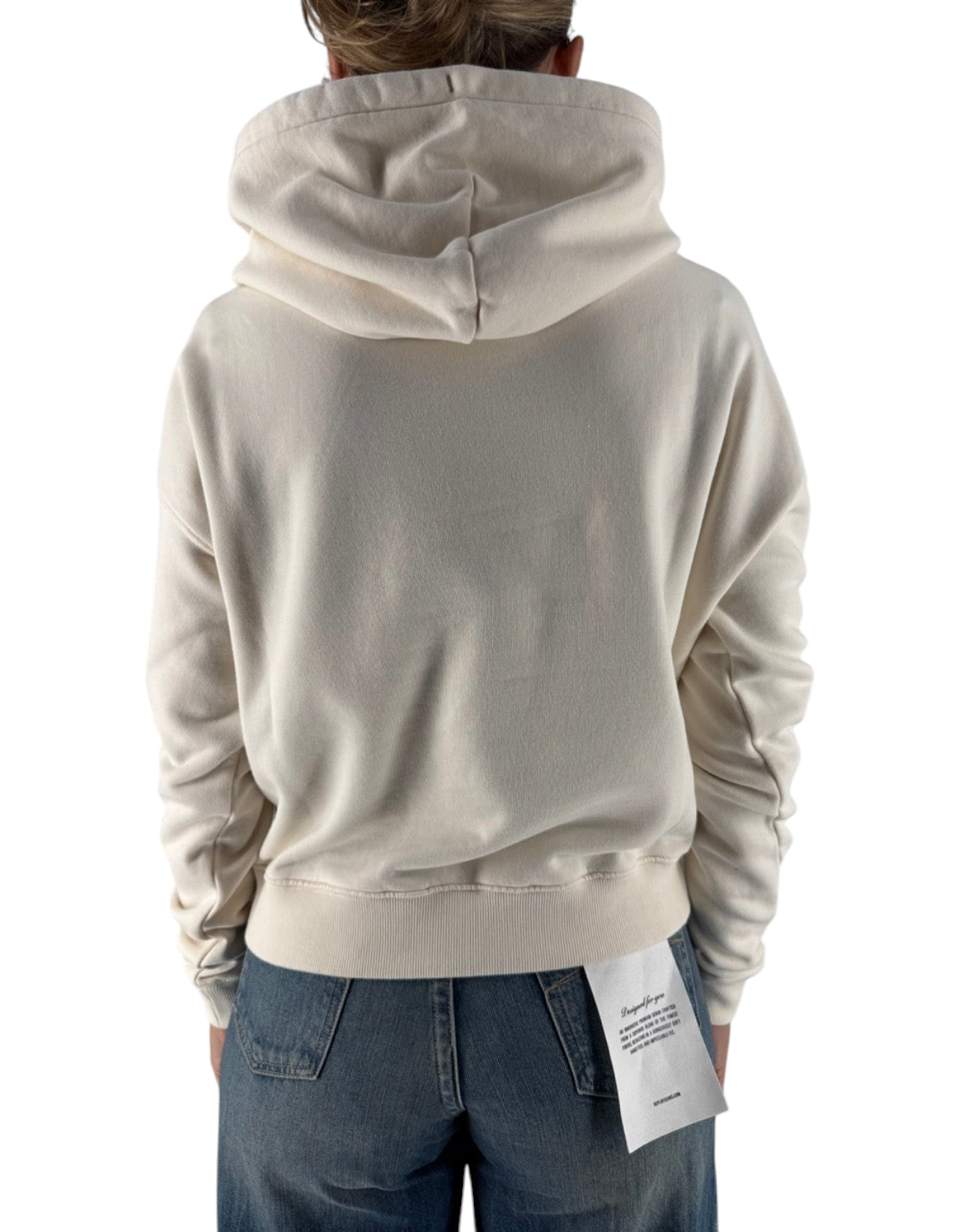 Vista posteriore di una felpa con cappuccio DevidLabel color crema in cotone indossata con jeans