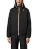 Modella indossa giacca K-Way Le Vrai 4.0 Claude Warm blu scuro con zip iconica e cappuccio, proposta da DevidLabel.